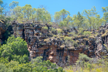 rugged Outback scenery in the Northern Territory of Australia, showcasing vast deserts, red rocks,...