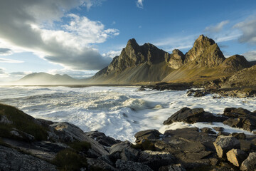 Famous Eystrahorn mountains and rocky coast at the shore of Hvalnes Peninsula in southeast Iceland