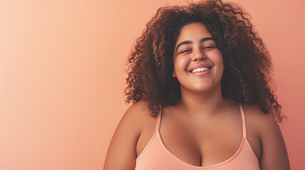 beautiful, plus size Latina woman looking happy, full body view, perfect skin, studio shot, peach light color background 
