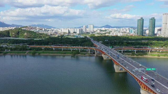 Aerial view of traffic in Seoul City South Korea along the Han River on a clear day