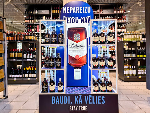 LATVIA, RIGA, 20, FEBRUARY, 2024: Promotional stand with Ballantine's blended Scotch whisky produced by the Chivas Brothers in Stockmann shopping mall, Riga. Latvia.
