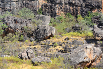 Rugged scenery in Outback Australia, with red dust plains, dramatic rock formations, and vast, open...