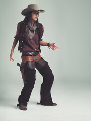 Woman, fashion and cowboy clothes with confidence in studio, western character and costume on white...