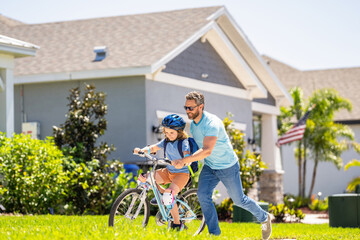 dad and son on biking adventure. dad and son duo pedaling through picturesque landscape. supportive dad guiding his son first bike ride. dad and son enjoying fun bike outing. Biking bonding time