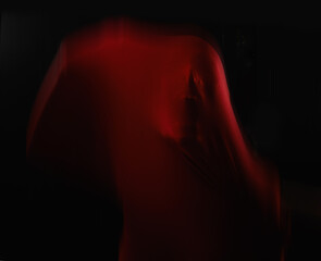 Scary, person and trapped in fabric for horror, art and drama on black background in studio....