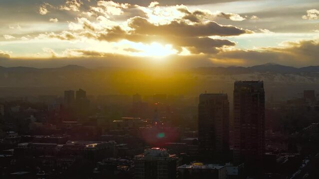 Sunset over the city skyline and mountains, drone hyperlapse, Denver, Colorado, 4K