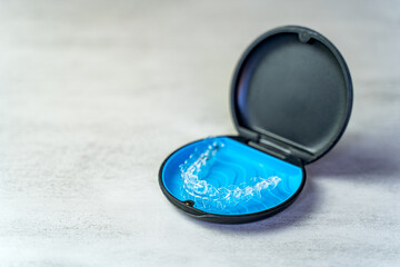 Invisible brace in the case. Taking care of dental health	