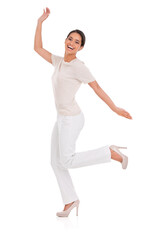 Woman, excited and celebration in studio for success, winning and achievement with fashion, bonus or sale. Portrait of a winner or happy model in heels with wow, jump or yes on a white background