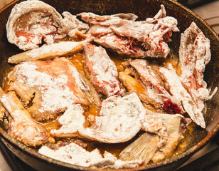 Fish in a frying pan in oil