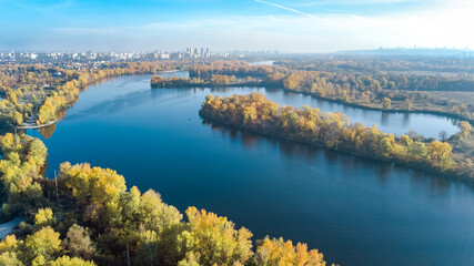 Kyiv city skyline and Dnipro river aerial drone view from above, Kiev Dnieper and Desenka river islands in autumn, Ukraine
