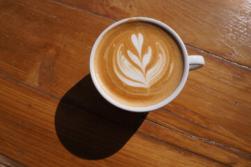 cup of cappuccino coffee on table