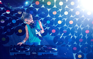 Woman dj, headphones and vinyl records in night club for party with turntable, lights and lens...