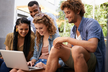 Laptop, education and group of friends on college or school campus together for learning or study. Computer, smile or university project with happy young man and woman students on academy stairs
