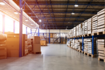 A storehouse interior with a background blur. The image captures a modern and large warehouse with...