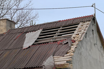 Amidst Bare Trees and Grey Skies Stands an old Building