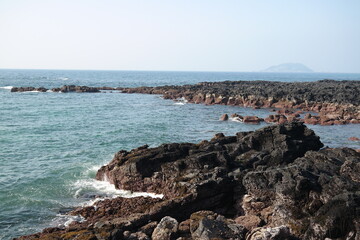 basalt beach and sea