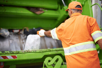 Man, garbage truck and dirt collection on street or recycling pollution for waste management,...