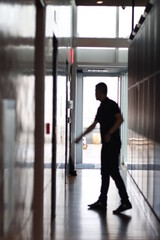 Silhouette of a person in a corridor