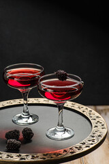 cocktail with juice decorated with blackberries