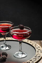 cocktail with juice decorated with blackberries