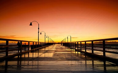 Fototapeta na wymiar Beautiful sunset over a long jetty