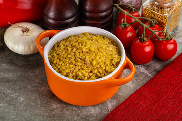 Dry wheat bulgur cereal heap