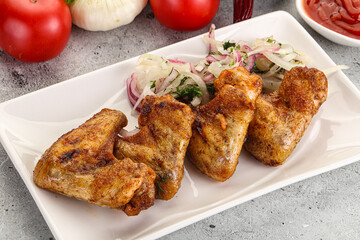 Grilled chicken wings with sauce