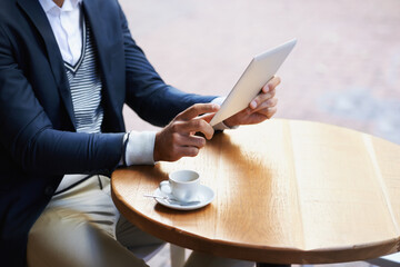 Businessman, outdoor and hands on tablet at cafe reading news, article or internet research....