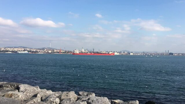 A cargo ship navigating the Bosporus Strait in Istanbul