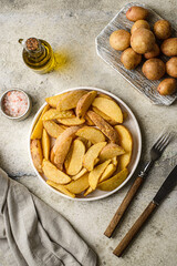 potato slices in a plate on a gray background