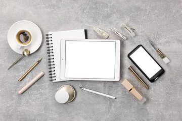 Flat lay composition with modern tablet on light grey table. Space for text