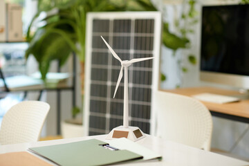 Model of wind turbine on table in renewable energy company office