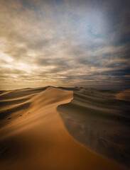 Fototapeta na wymiar Sand dunes Sahara Desert at sunset and sandstorm, 3D illustration