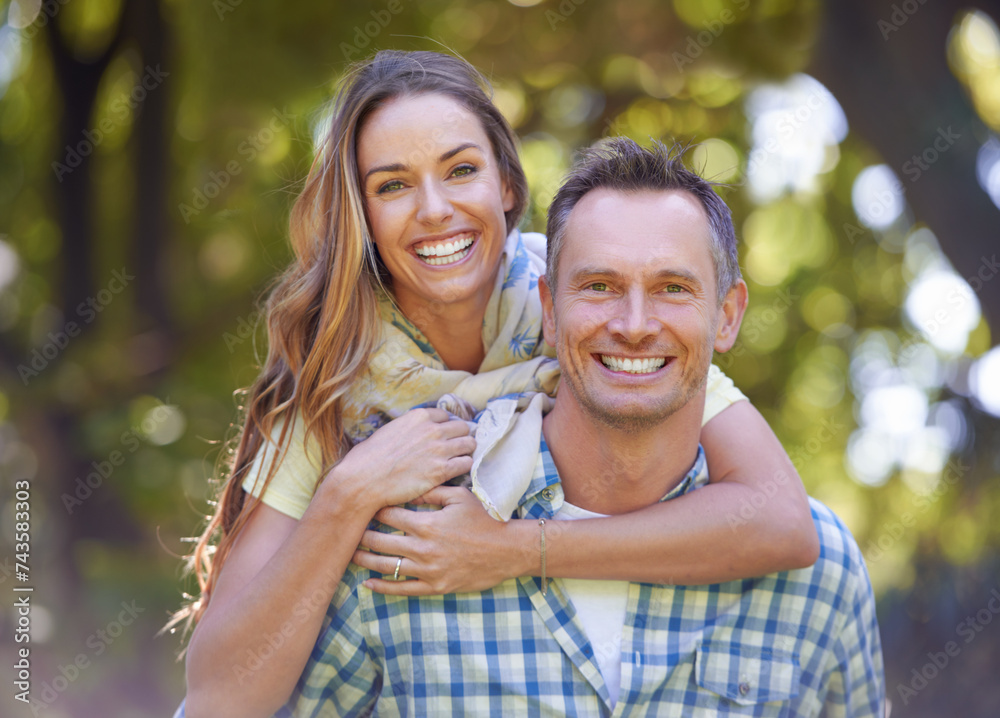 Wall mural Portrait, embrace and couple with smile in park for summer romance, trees and fun outdoor date. Love, mature man and happy woman in garden with morning sunshine, hug and marriage bonding in nature.