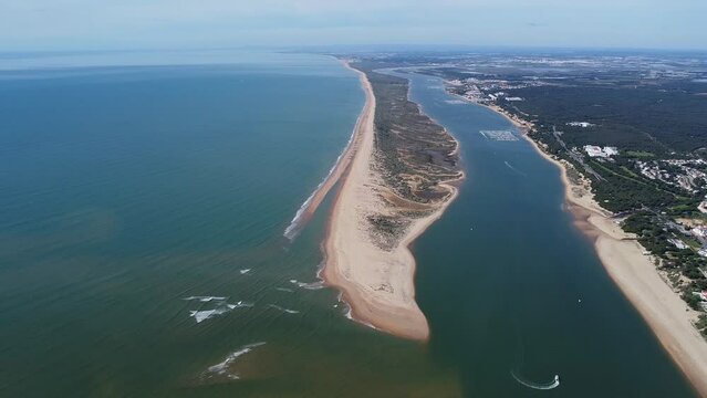 Aerial view of the Rompido Arrow (La Flecha del Rompido), a sand bank formed on the Rompido and Portil beaches that already reaches La Bota beach, in the municipality of Punta Umbria, Huelva province