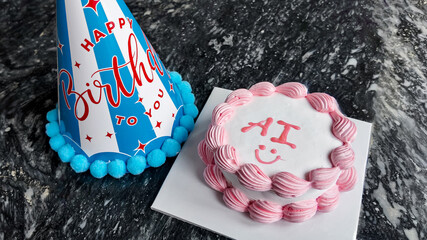 Celebratory birthday concept featuring a festive hat and cake with AI inscription, on a textured dark marble background with ample copy space