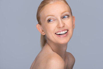  Young, beautiful 35 years old woman on grey background. Spa, anti-aging treatment, face lifting...