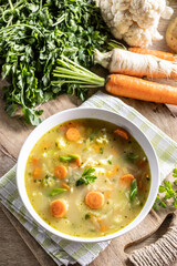 Spring vegetable soup with chopped and grated root vegetables, seasoned with yeast. Healthy vegetable vegetarian food - 743646519