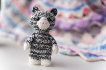 Knitted toy cat on a white background - 743656931
