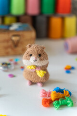 Knitted hamster toy with yarn and knitting accessories - 743657718