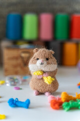 Knitted hamster toy with yarn and knitting accessories - 743657729