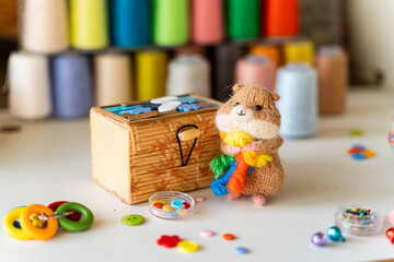 Knitted hamster toy with yarn and knitting accessories - 743657779