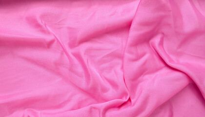 Pink crumpled polyester. The texture of the fabric, useful as a background. for your projects or backgrounds
