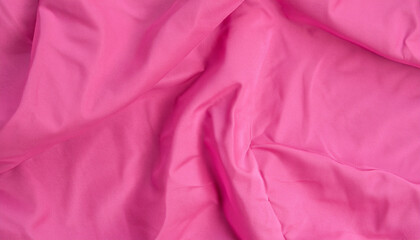 Pink crumpled polyester. The texture of the fabric, useful as a background. for your projects or backgrounds