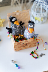 Knitted crow toys with decorations and shiny objects - 743658599