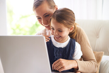 Laptop, education or smile with mother and daughter on sofa in living room of home to study together. School, elearning or online homework with woman parent and girl child in apartment for growth