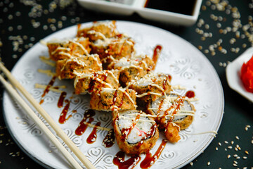 Plate of Food With Chopsticks and Sauce