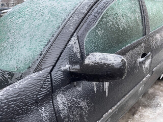 A car covered in ice after a freezing rain.
