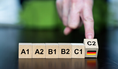 Symbol for learning the German language. Wooden cubes show the skill level A1 to C2.