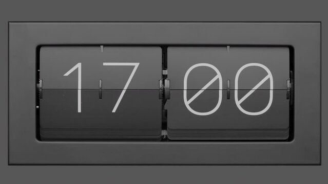 Flip clock quickly flips. Retro flip clock changing from 16:59 to 17:00. Slow motion. Close up.